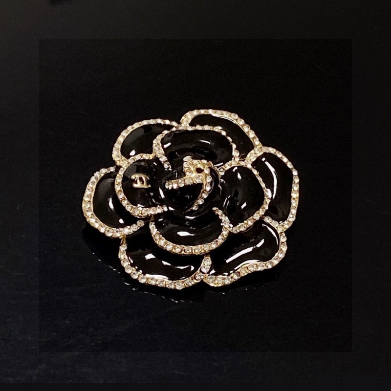 Ch*el brooches